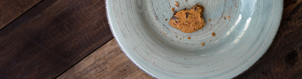 Half-eaten cookie on a plate