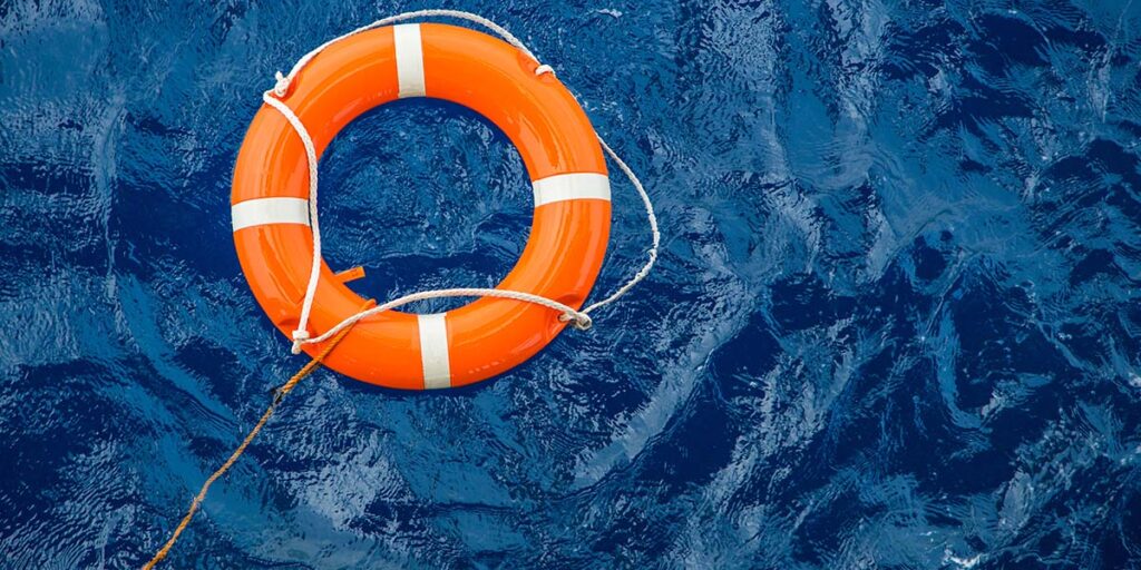 Life ring in ocean water to save