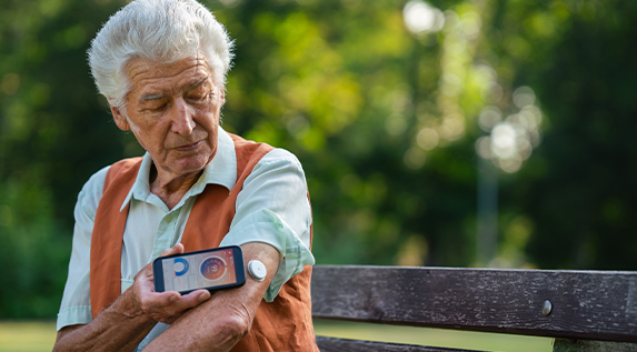 Elderly patient using medical suppies